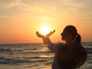 Woman Holding the Sunrise