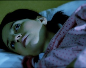 Woman Lying Awake in Bed